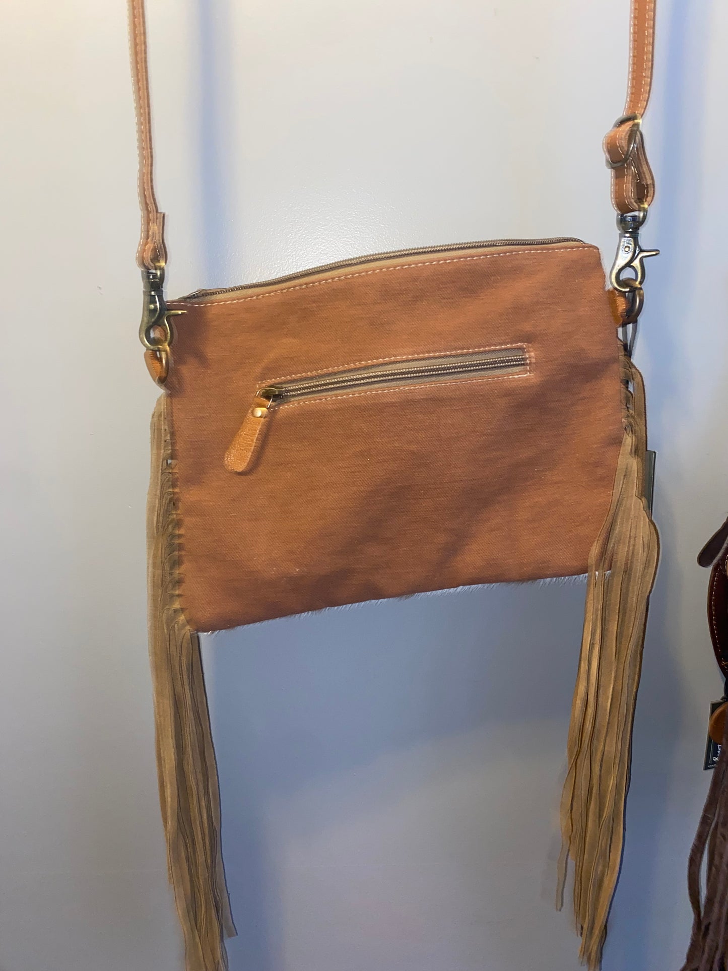 Brown cowhide tassel purse