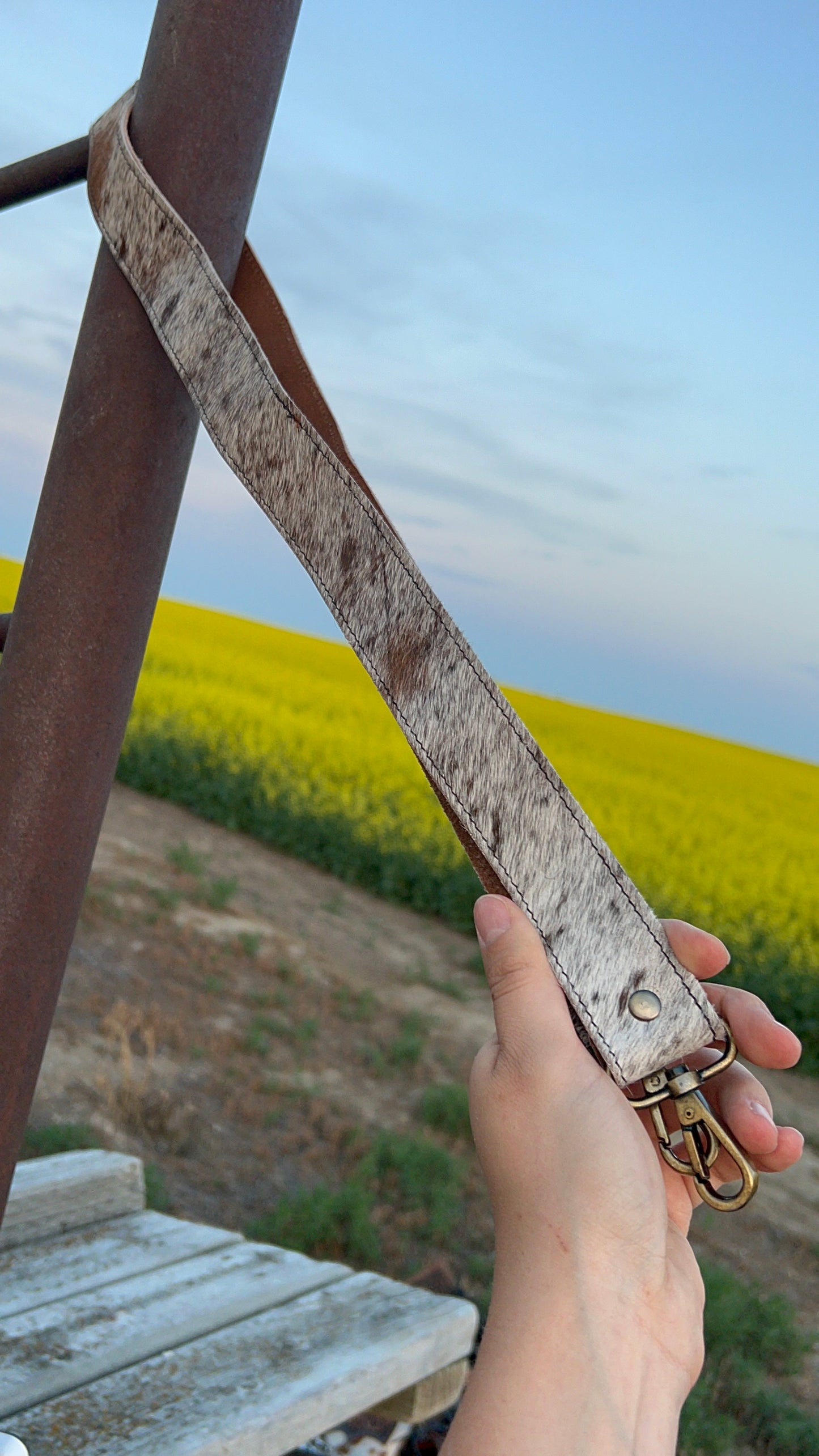 Light colored hide purse strap