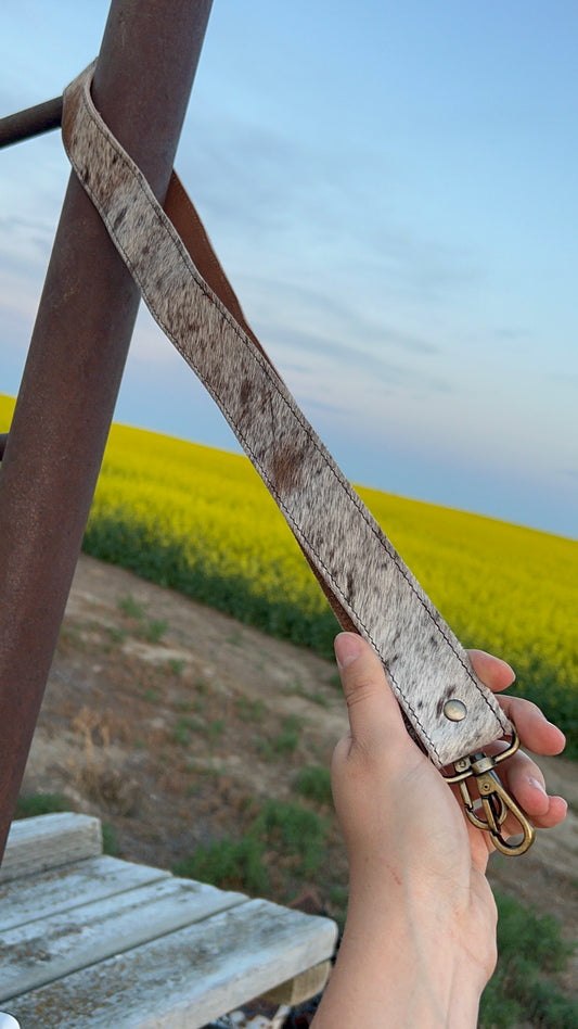 Light colored hide purse strap