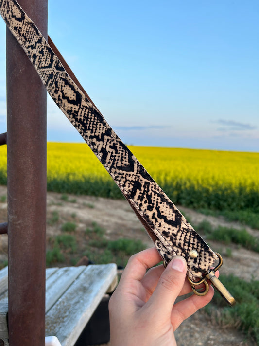 Snake print pattern on a hide purse strap